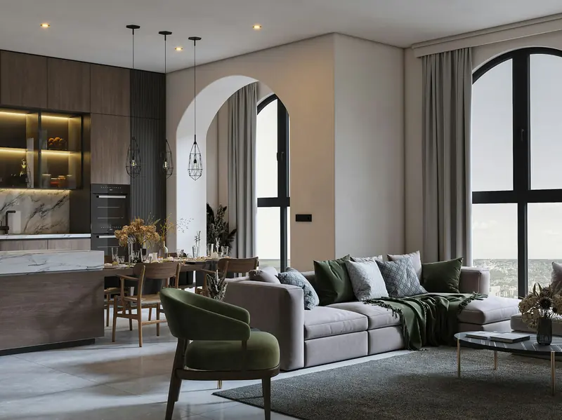 Salón con arco, sofá gris y cocina abierta